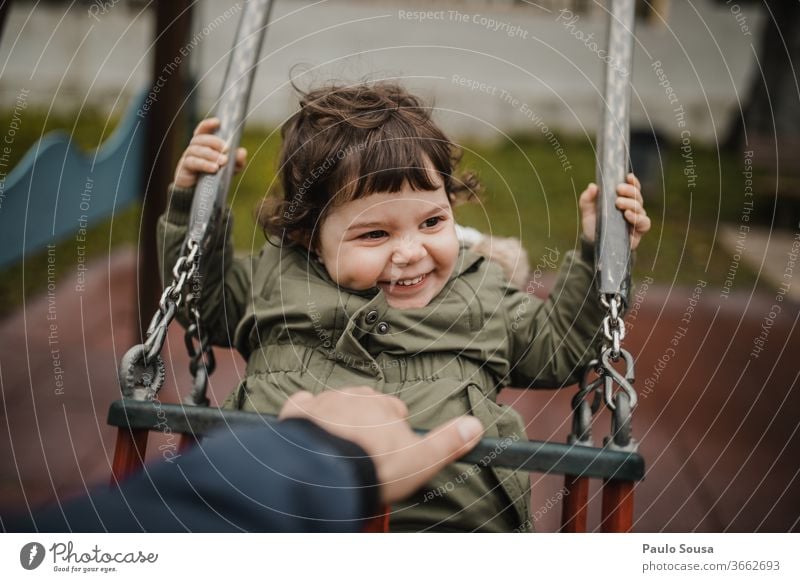 Child on swing Swing Playground Park Funny fun Happy Happiness fatherhood Father Children's game childhood Infancy happy Exterior shot play playful Colour photo