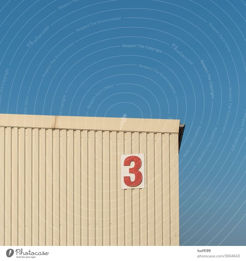 the red three at the storage shed 3 number Digits and numbers Sign Signs and labeling House number Wall (building) Characters Warehouse warehouse Flake