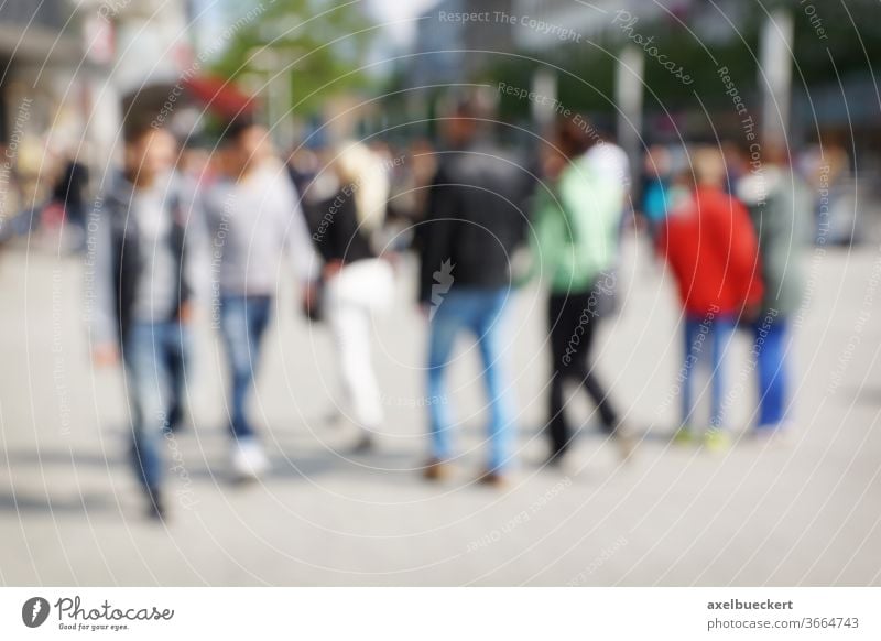 defocused city people blur crowd urban street background pedestrian walk shopping downtown men women blurry blurred out of focus abstract scene life lifestyle