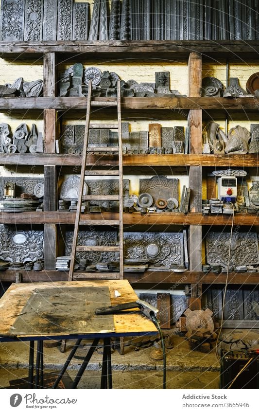 Jewelry workshop with metal details on shelves jewelry goldsmith shelf craft production grunge tool various equipment assorted weathered collection storage