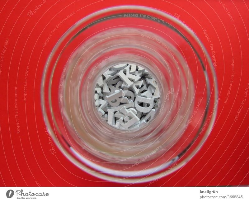 A glass vase from above, filled with small, white wooden letters Vase Letters (alphabet) Bird's-eye view plan Colour photo Deserted Shallow depth of field