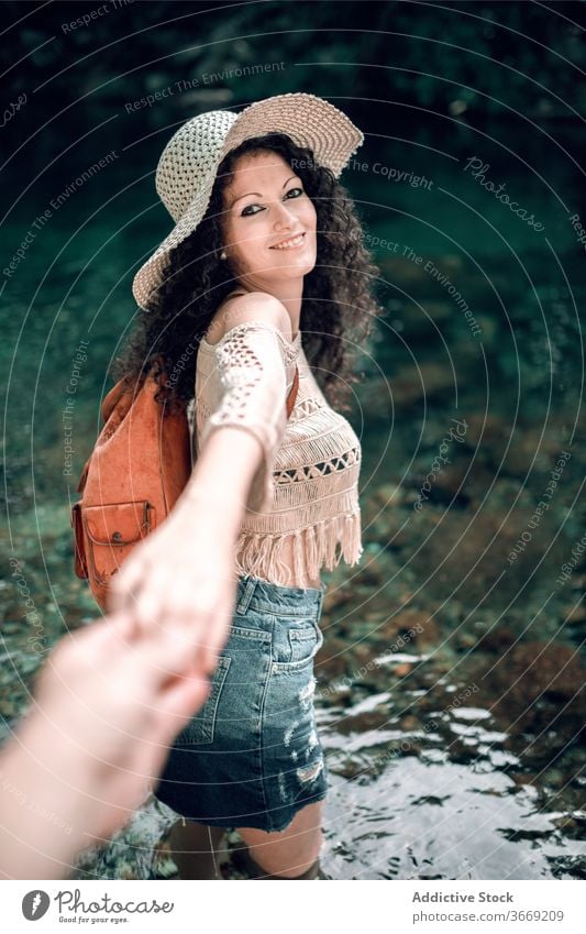 Charming woman holding hands with boyfriend follow me couple river vacation summer girlfriend together happy travel trip relax smile partner water traveler