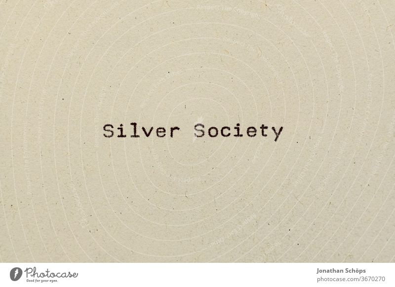 Silver Society as text on paper with typewriter Age group Mileu Paper Recycling Pensioners Typewriter writing silver society typography Old Analog English Retro