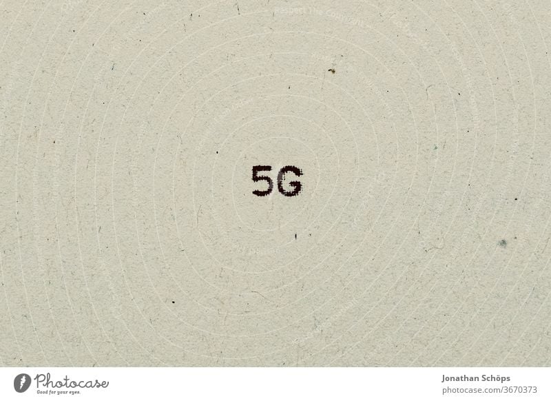 5G as text on paper with typewriter 5g 5G Expansion digitization Advancement peril Speed Net Paper Recycling Typewriter writing Radiation typography Analog