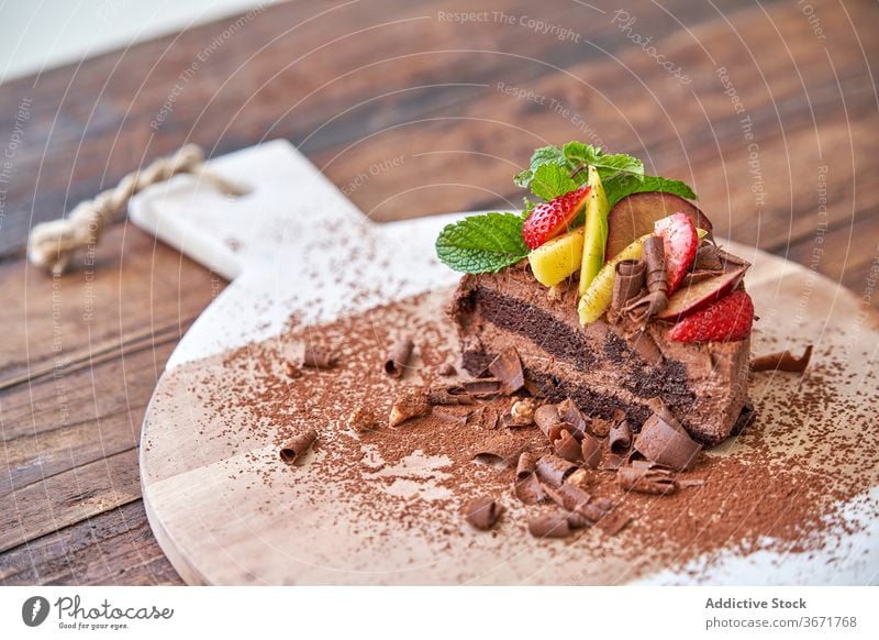 Chocolate dessert with fresh fruits cake chocolate confectionery sweet mousse cut garnish berry food palatable cocoa mint serve gourmet piece eat strawberry