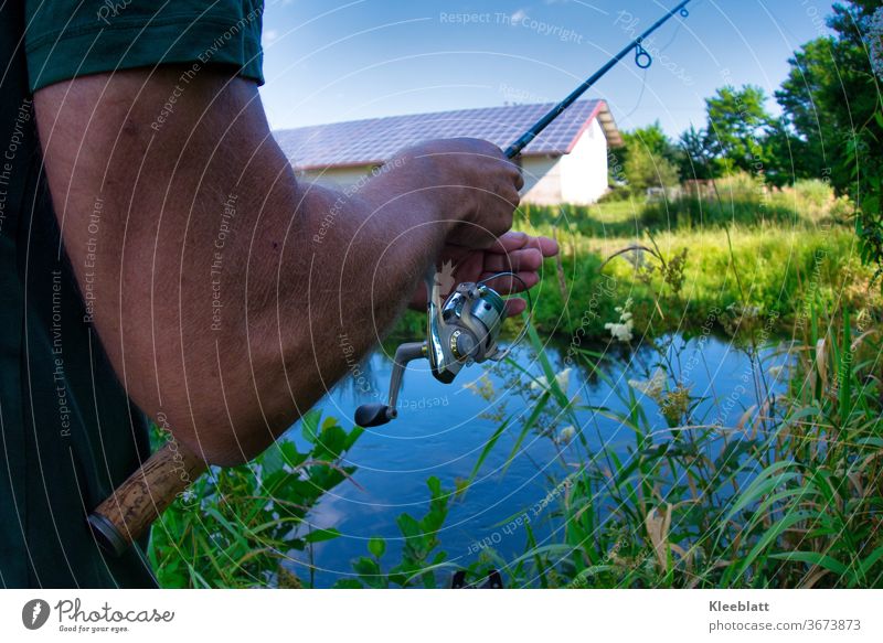 Angler is setting up his rod. Fish Water Fishing industry River River bank Fisherman Fishing (Angle) Colour photo Exterior shot Leisure and hobbies Fishing rod