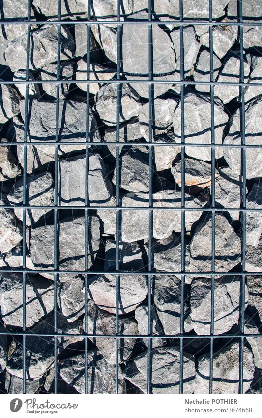 Stones and grid stone stones shadow Shadow Close-up Exterior shot Day Minerals Colour photo Gray arrangement wall Detail Wall (barrier) Arrangement