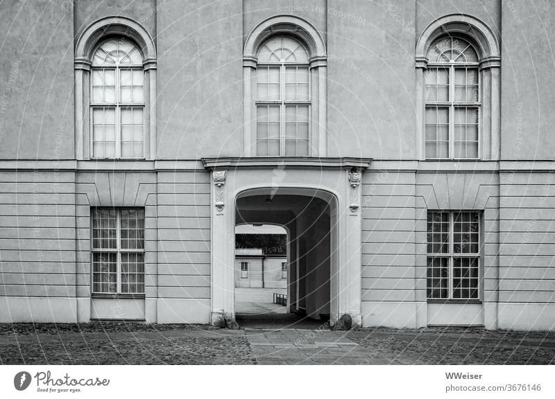 Entrance to the castle courtyard, wide enough for carriages Lock Facade Brandenburg Rheinsberg Shadow void silent tranquillity History of the Architecture Empty