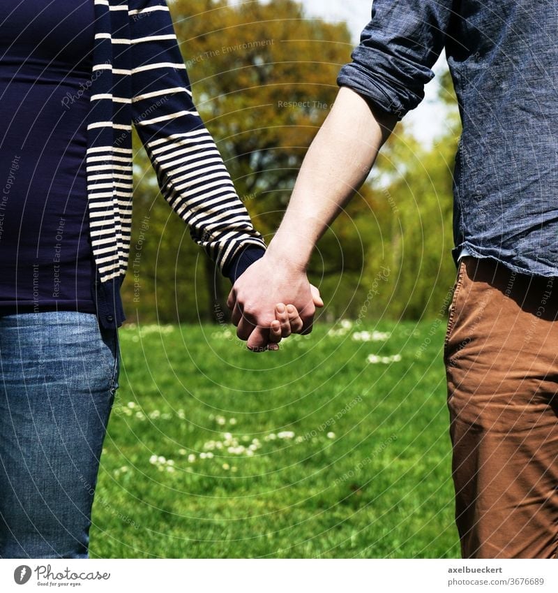 couple holding hands friendship relationship love woman girl boy girlfriend boyfriend wife husband male female lovers real authentic standing together