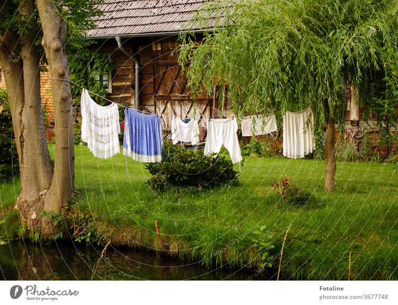 Washing day - or a washing line with hung laundry in the Spreewald. The socket is the hit! Laundry Clothesline Clothes peg Rope leash Dry Clean Clothing Hang up