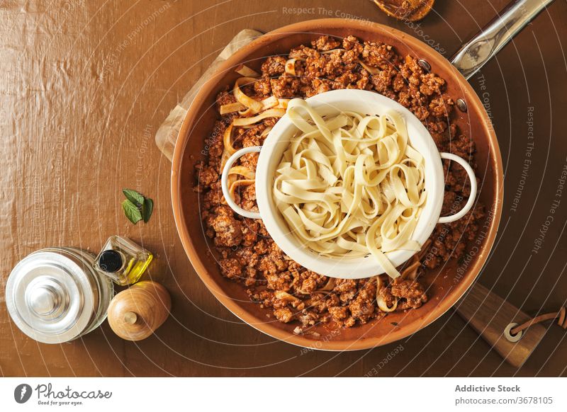 Pasta and Bolognese sauce on table bolognese pasta food prepare cook pan cuisine culinary ingredient meal recipe meat kitchen natural homemade tasty dinner