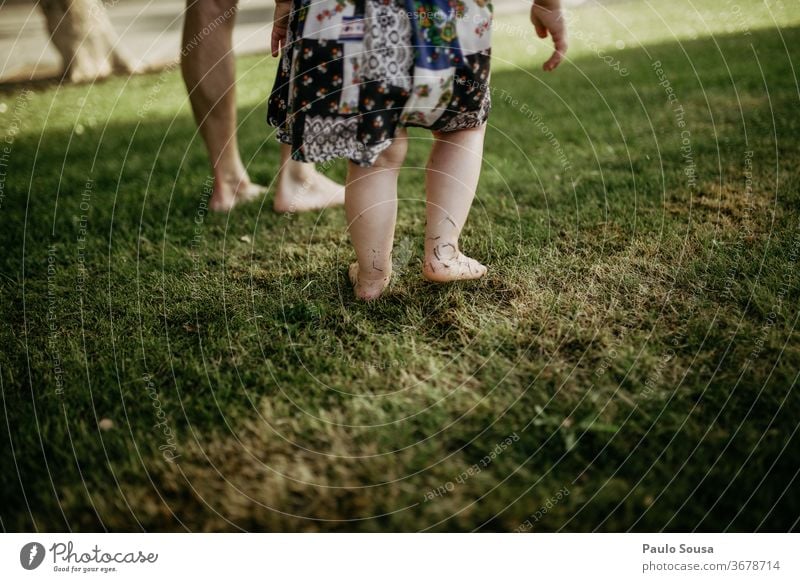 Father with daughter barefoot on grass Barefoot Grass fatherhood Father with child Family & Relations Infancy Together Child Exterior shot Vacation & Travel