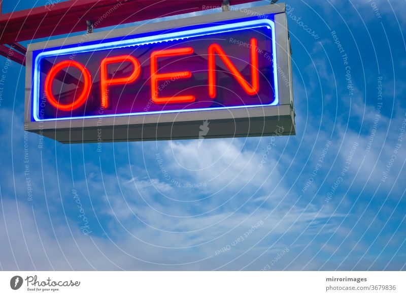 open neon sign red and lue on sky background black blue bright business clouds color commercial concept decoration design electric electricity entrance glow