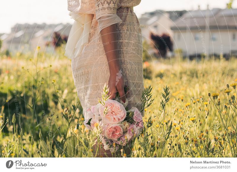 Detail of a Caucasian woman holding a bride bouquet. Flowers and plants in the background. Bouquet Bride Wedding Bride groom Colour photo Love