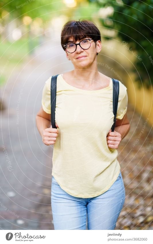 Beautiful Middle-aged woman walking down the street female outdoor mockup cute lifestyle casual caucasian cheerful care single sitting beautiful leisure summer