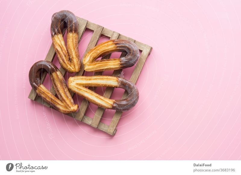 Churros with chocolat typical  sweet breakfast background baked brown caramel chocolate churro churros cinnamon closeup cooking cuisine cup delicious dessert
