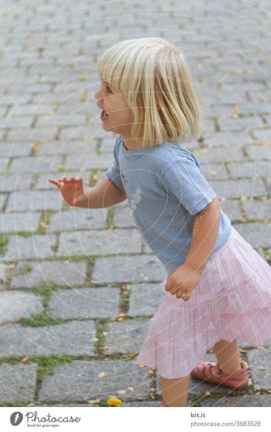 catch me... Child Infancy girl Human being Playing luck Lifestyle Action Joy Cheerful smile Playful Summer game Effortless pedestrian shades Cobblestones Catch