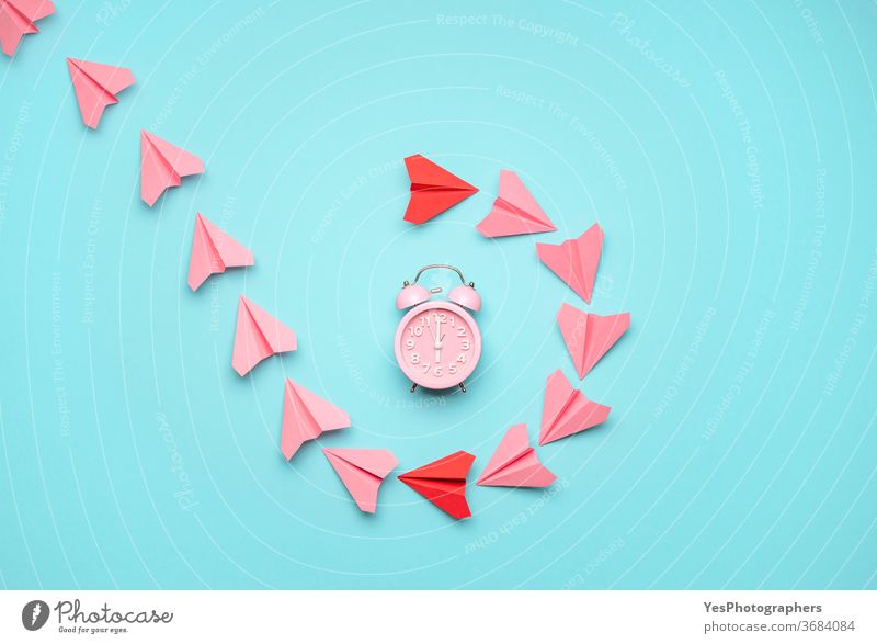 Time management concept with a clock and paper airplanes. Time flies concept, top view above view alarm clock alert awake bell blue break business controlling