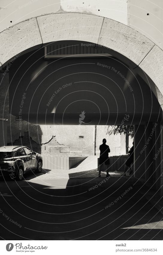 His new toy Backyard Detail street photography semi-strong Shadow Silhouette car Parking Glittering conversation Copy Space bottom Copy Space top Archway