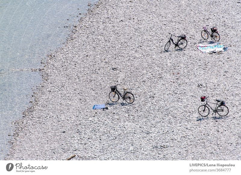 Bicycles on the beach waiting for the owners background bicycle blue copy space day daylight lake leisure nature river shore strand summer sun sunny water