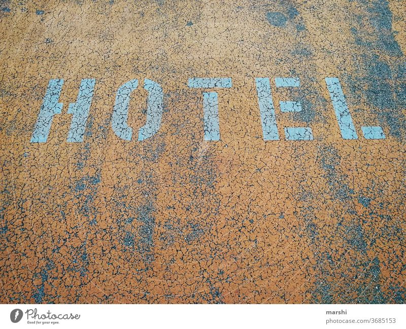 HOTEL Hotel Street parking area Parking lot Concrete travel voyage urban Detail on the outside Orange Abstract Town Letters (alphabet) Word Travel warning