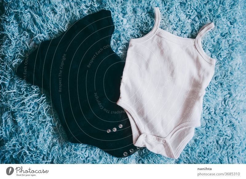 Beautiful mockup of baby body against soft turquoise background mock up design empty empty space negative space copy space black white blue model clothes