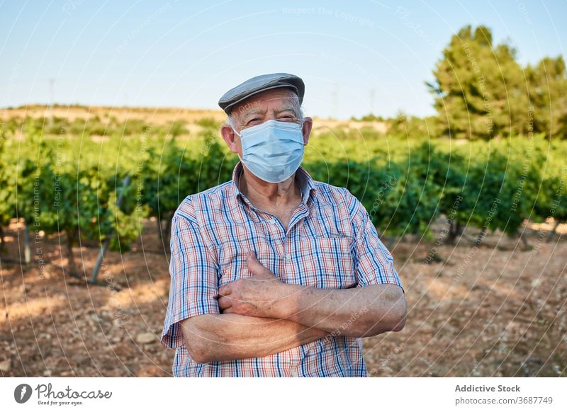 Senior man in medical mask in countryside senior elderly protect coronavirus covid summer nature male old aged covid19 infection pandemic retire pensioner