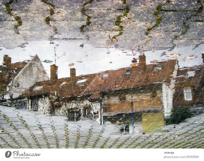 Row of houses in puddle House (Residential Structure) Apartment Building Puddle Reflection Autumn Stone slab Perspective Wet optical illusion