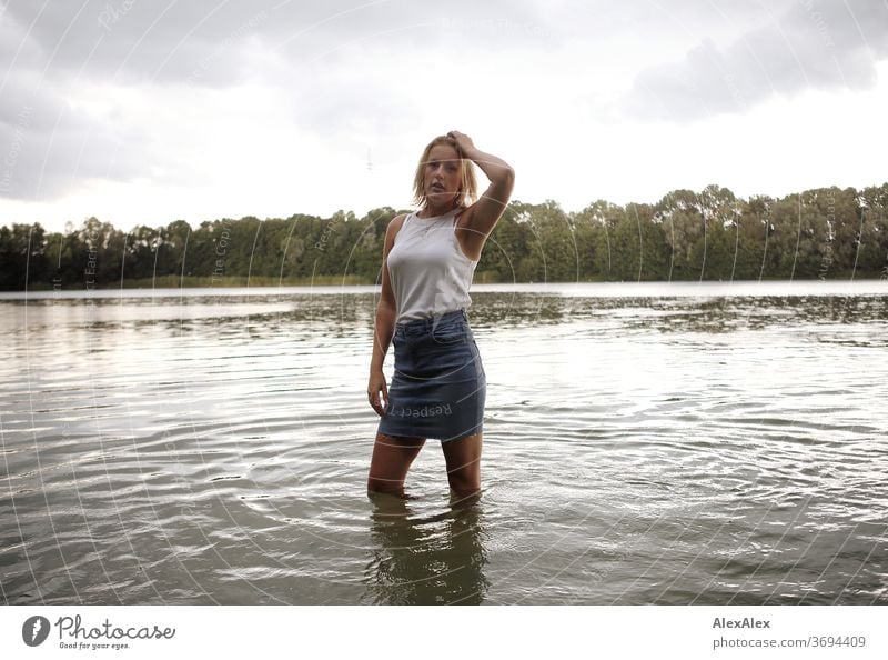 Portrait of a young woman in a lake Young woman Woman Blonde smile portrait Jewellery already Long-haired Landscape tanned Self-confident Summer natural