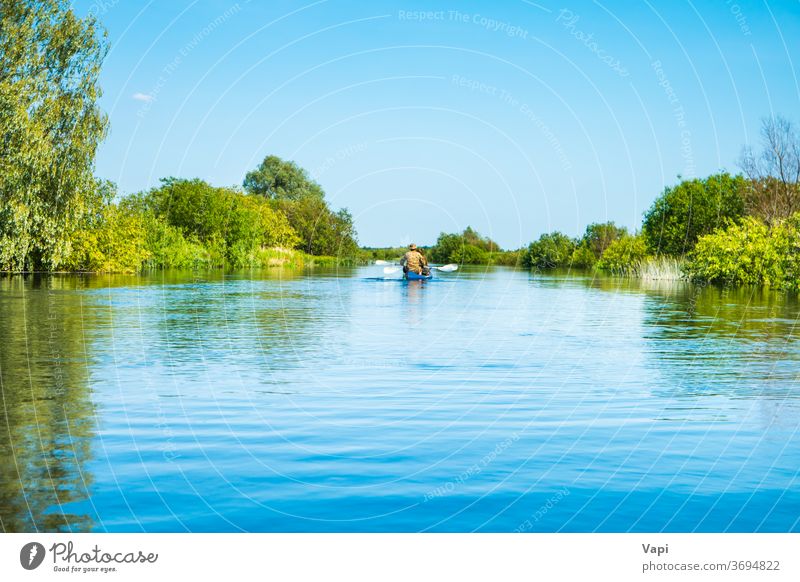 Couple at kayak trip on blue river landscape people water canoe nature tree forest cloud calm sky travel green summer view outdoor beautiful natural environment