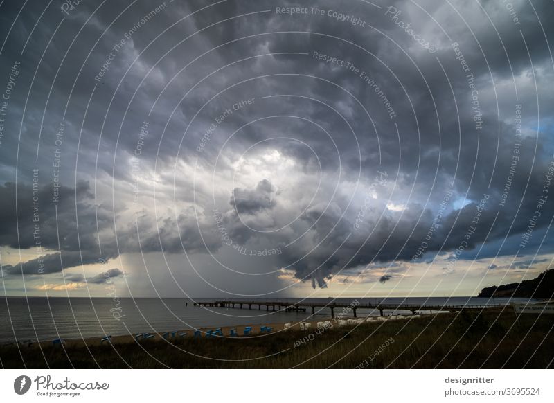 Climate change - storms over the sea Ocean Clouds Storm Beach coast Rain Gale Bridge Sea bridge goehren Baltic Sea Rügen Global warming Threat Threaten threat