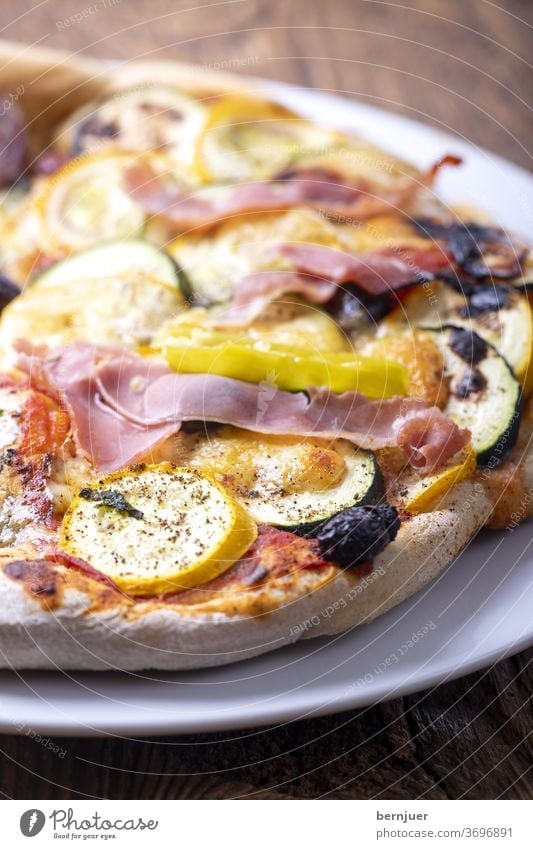 Pizza with zucchini Plate Zucchini Ham Cheese wood Food Meal Italian zucchini pizza vegetable pizza baked Table Fresh Diet salubriously Eating Dinner Vegetable