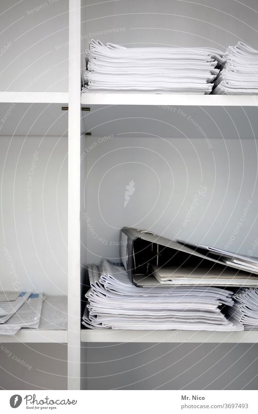 Papers and folders are stored in an office cabinet Shelves White file Workplace File Arrange Accountancy Work and employment file files Cupboard Data Business