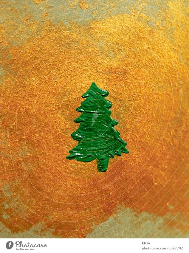 Green painted fir tree on golden background. Christmas. Painted Fir tree Christmas decoration Decoration Christmas tree structure centred symbol