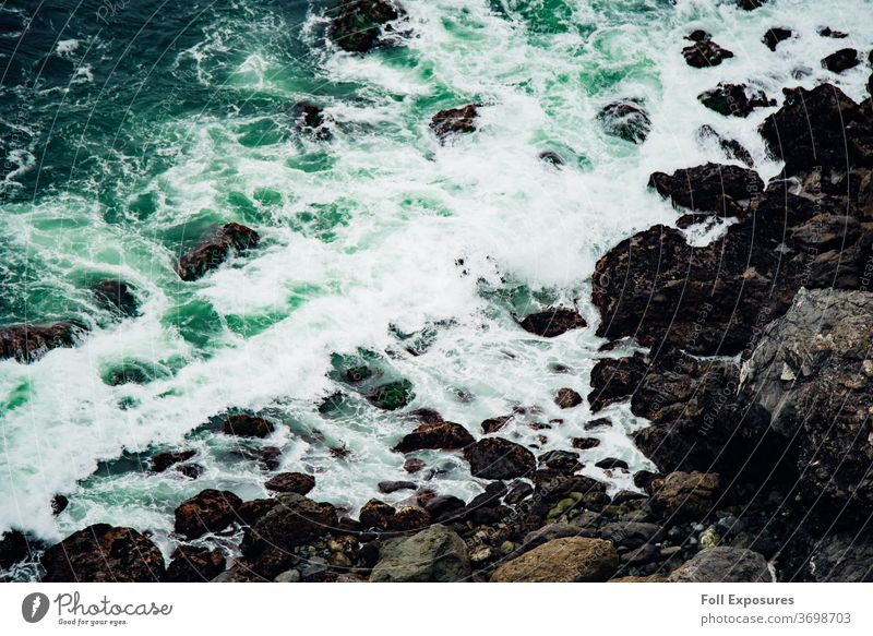 Seafoam green waves crash upon the ocean shoreline in Big Sur, California beach california Exterior shot Pacific Ocean Vacation & Travel Colour photo Coast