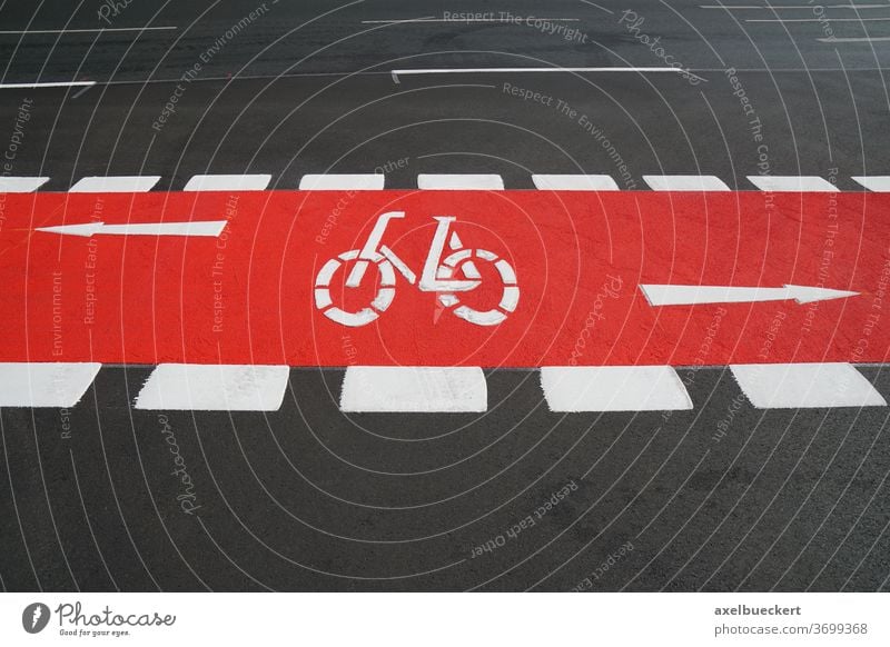 bike lane painted red bicycle path cycleway cycling track traffic street road designated city symbol transport biking travel asphalt safety transportation