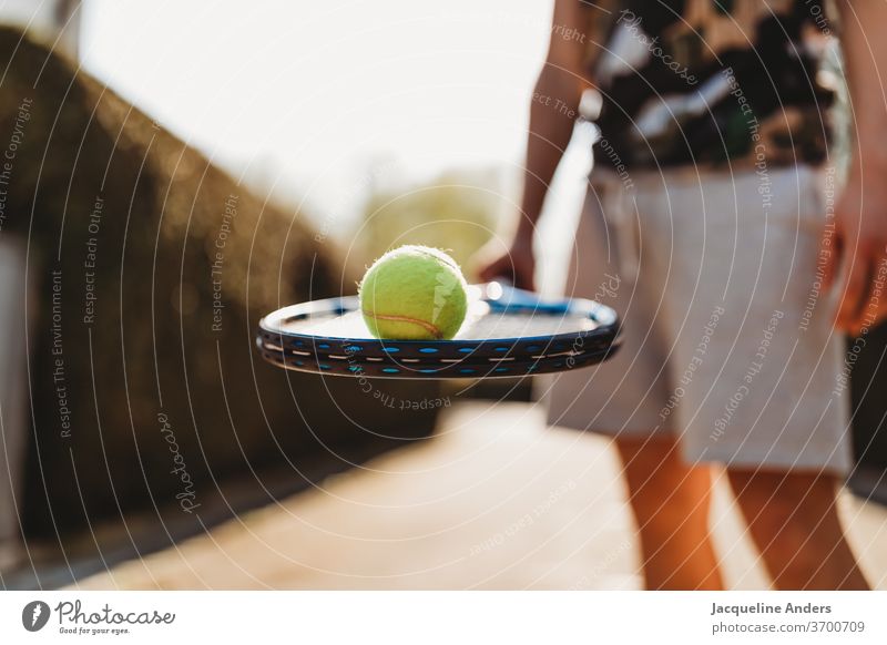 Young man with tennis racket and tennis ball Tennis rack Ball Tennis ball person Man youthful more adult teenager Sports Lifestyle Manly Guy Outdoors free time