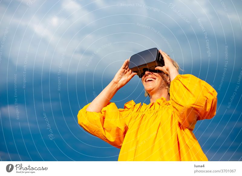 Woman with VR - glasses VR glasses virtual reality 3D 3D - glasses Eyeglasses virtual reality glasses look Virtual Cyberglasses Digital technology digitization