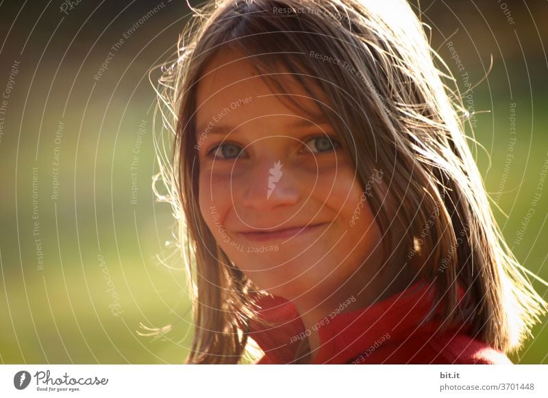 Girl in the evening light Child girl Impish Laughter Joy portrait Grinning Brash Face Infancy smile Happiness luck Contentment