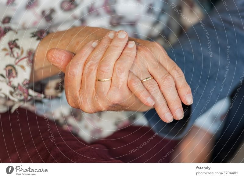 Hands of an 80 year old married couple 80 years old Retirement Married couple Wedding ring Gold ring Ring Adult Life Pensioner Seniors older together Caucasian