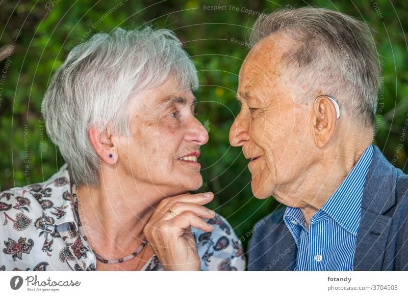 Retired couple shortly before a kiss Kiss Tenderness Person Luck married 80 years old Relationship Park Intimacy charming Partner Closeness side by side