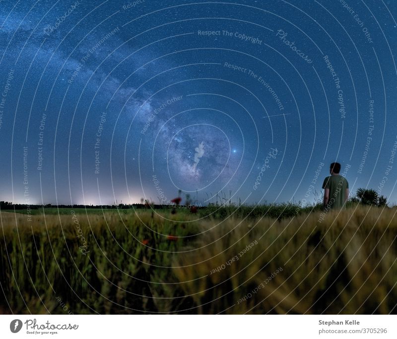 Man watching the milky way standing at a growing field at night man milkyway space galactical centre starlight astrophotography background nature galaxy sky