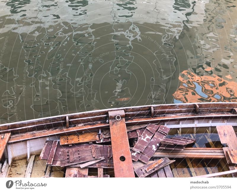 Leaked boat Rowboat Water Channel Venice Broken Debris boards reflection Reflection Tourism City trip Italy Exterior shot Deserted Colour photo Port City