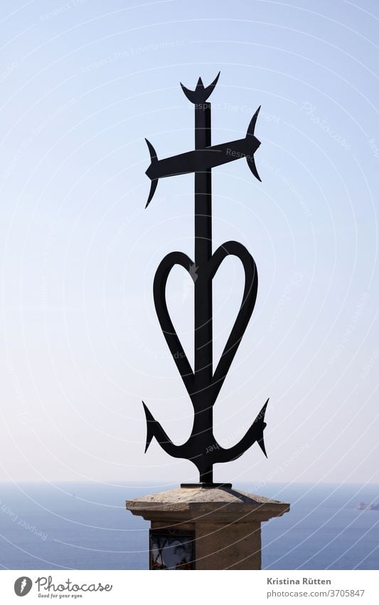 monument with anchor, heart and cross Anchor Heart Crucifix Ocean Sky symbol Sign symbolic commemoration souvenir Monument Memory weaker Death mourn drowned