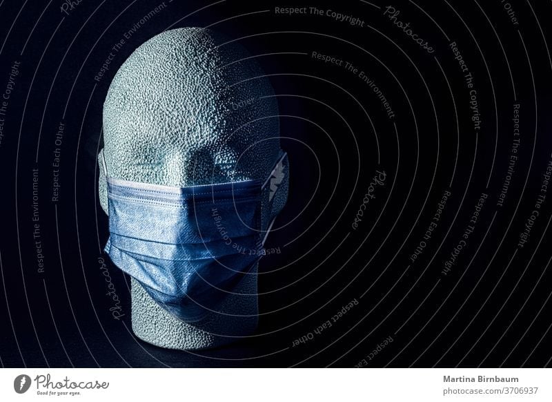 Wearing is caring. Styrofoam human head with face mask . COVID-19 copy space isolated styrofoam art wearing is caring pandemic covid-19 texture care science