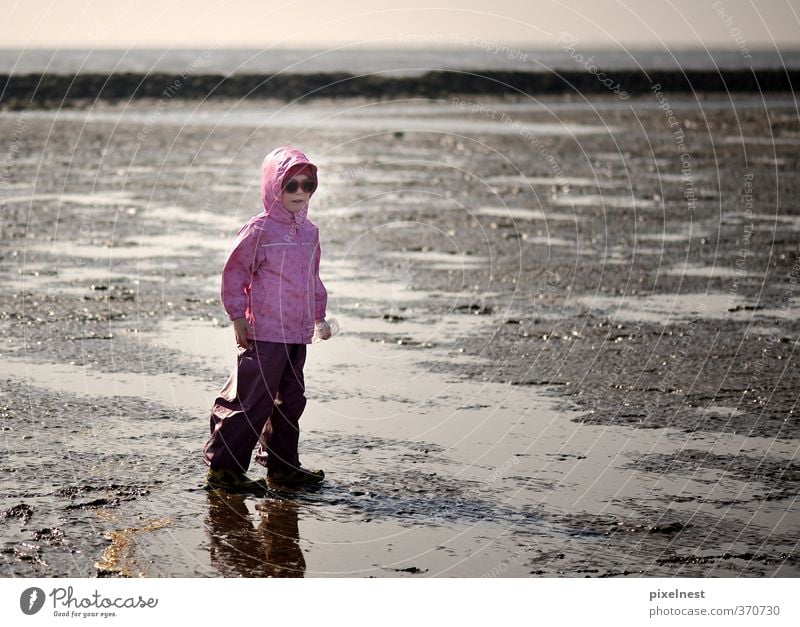 Girl in the wad Playing Vacation & Travel Far-off places Summer Summer vacation Sun Beach Ocean 1 Human being 3 - 8 years Child Infancy Sand Water Clouds
