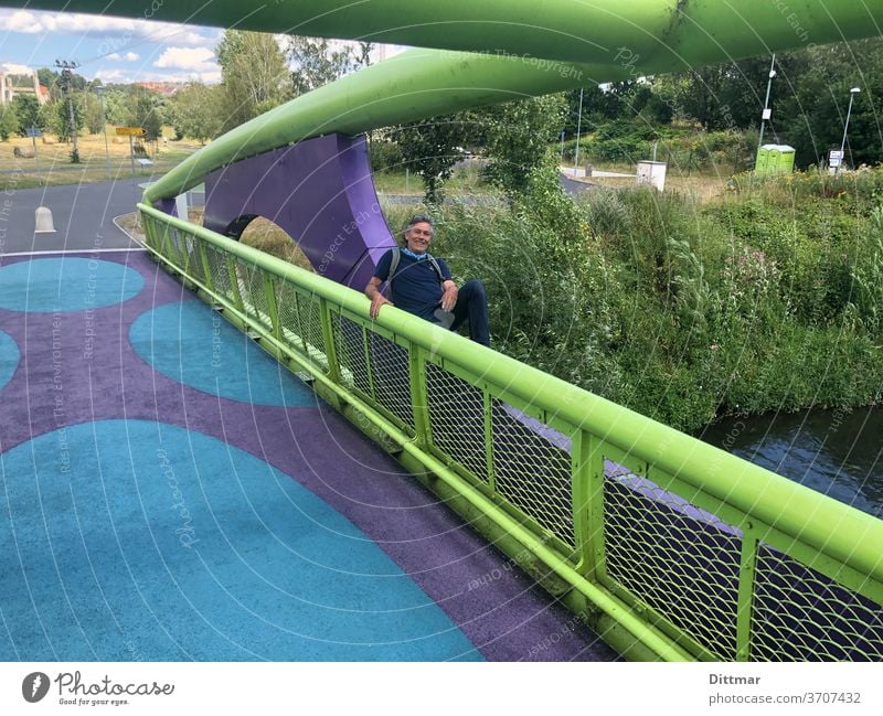 Colorful bridge over the river Eger with beautifully lit background Bridge variegated Man Cast iron lining Cheb Trip