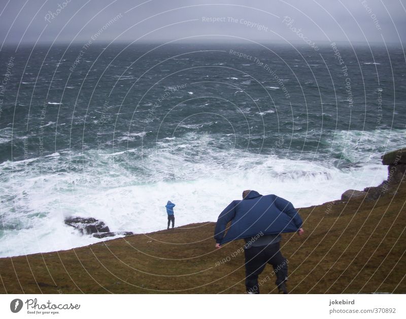 Fight against the forces of nature Human being Masculine Gale Waves Coast Ocean Cliff Pants Jacket Hooded (clothing) Unwavering Force of nature Atlantic Ocean