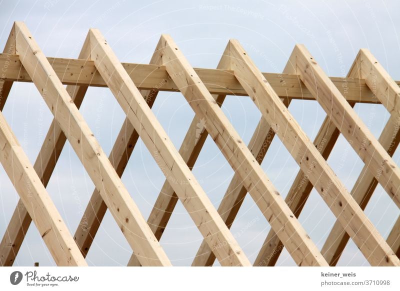 Roof truss made of wood in carcass roof truss Wood House (Residential Structure) Build Cost of materials Craft (trade) lumber timber construction House building