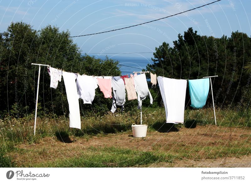 Outdoor clothesline Laundry Outdoors Washing Washing day Household Living or residing Housekeeping Photos of everyday life Clean Cotheshorse Clothes peg